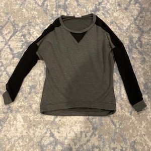 Women long sleeved top with sheer sleeves